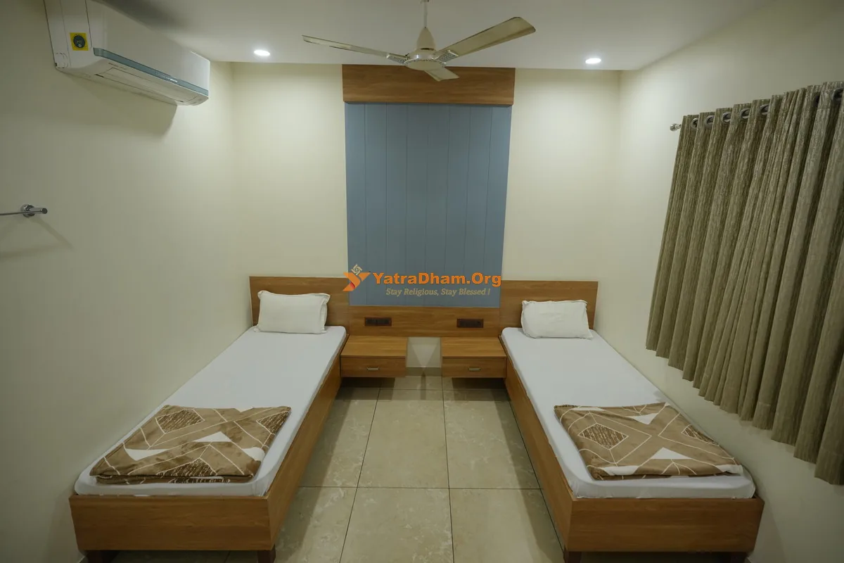 Air-conditioned twin bed room at Shree Harikrishna Bhuvan, Bhuj